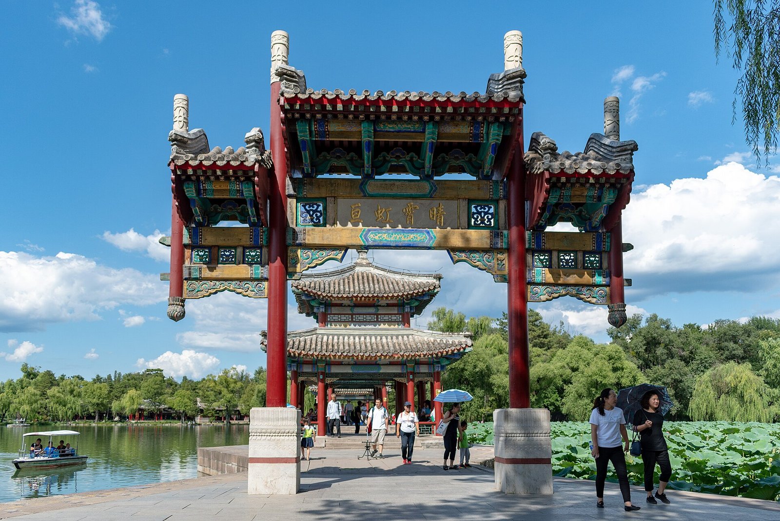 Chengde Mountain Resort: Imperial Autumn Beyond the Wall 6 Ornate painted paifang archway and pavilion beside the lake at Chengde Mountain Resort