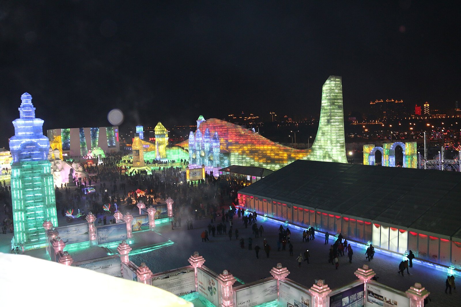 Illuminated ice towers and palaces at Harbin Ice and Snow World at night
