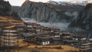 Four Tibetan villages in Zhagana, Gannan, beneath limestone cliffs at sunrise