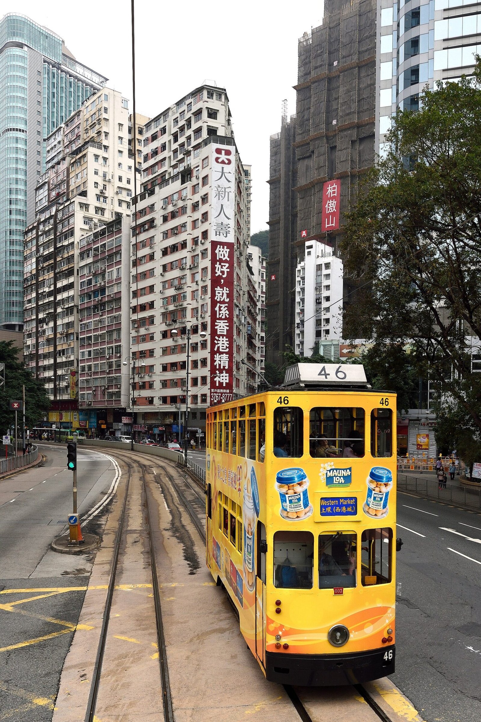 Green double-decker ding ding tram on Hennessy Road in Hong Kong