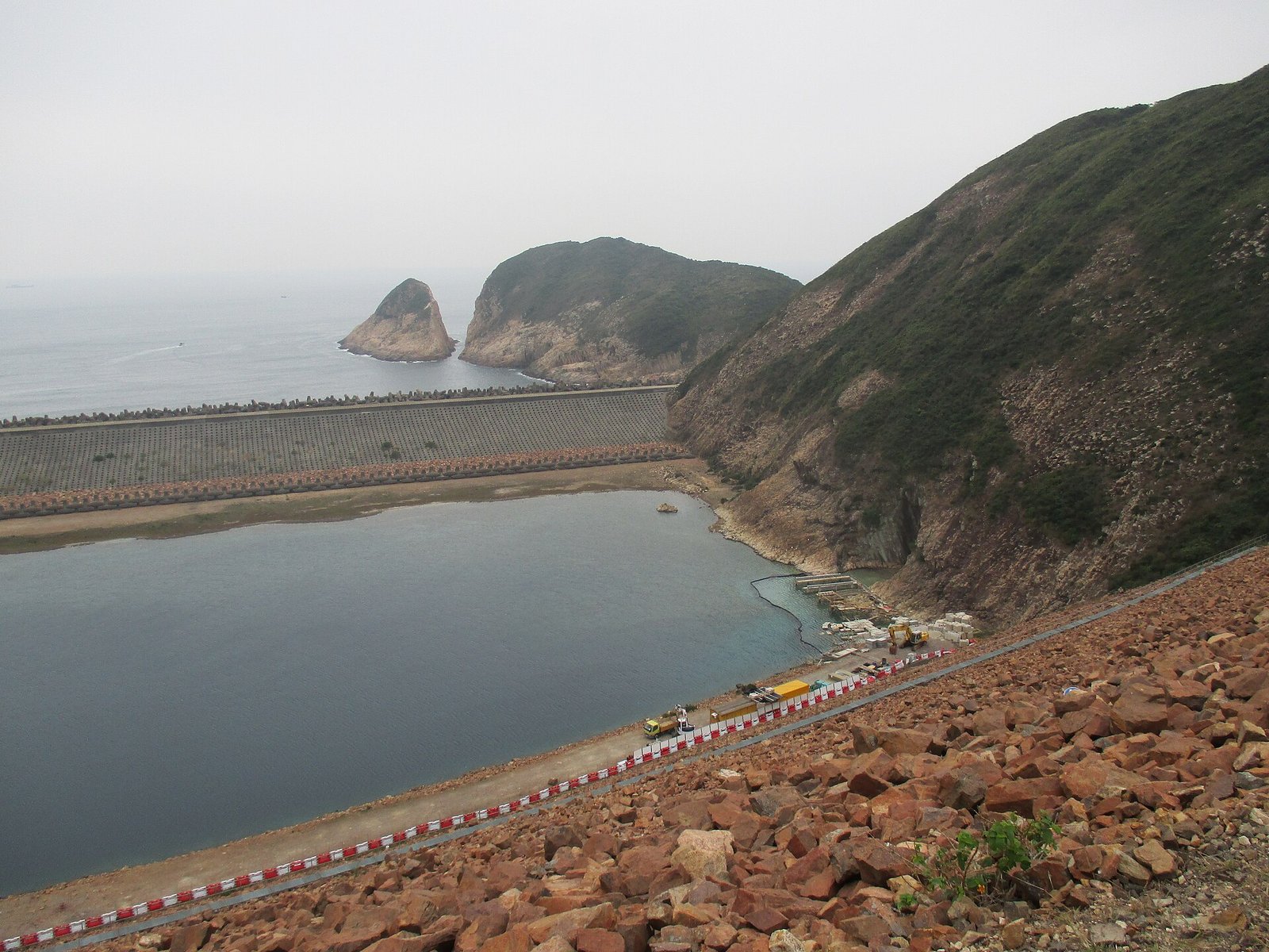 Hong Kong Geopark: Walking Among Hexagonal Stone Giants 3 High Island Reservoir East Dam with the reservoir on one side and the open sea on the other