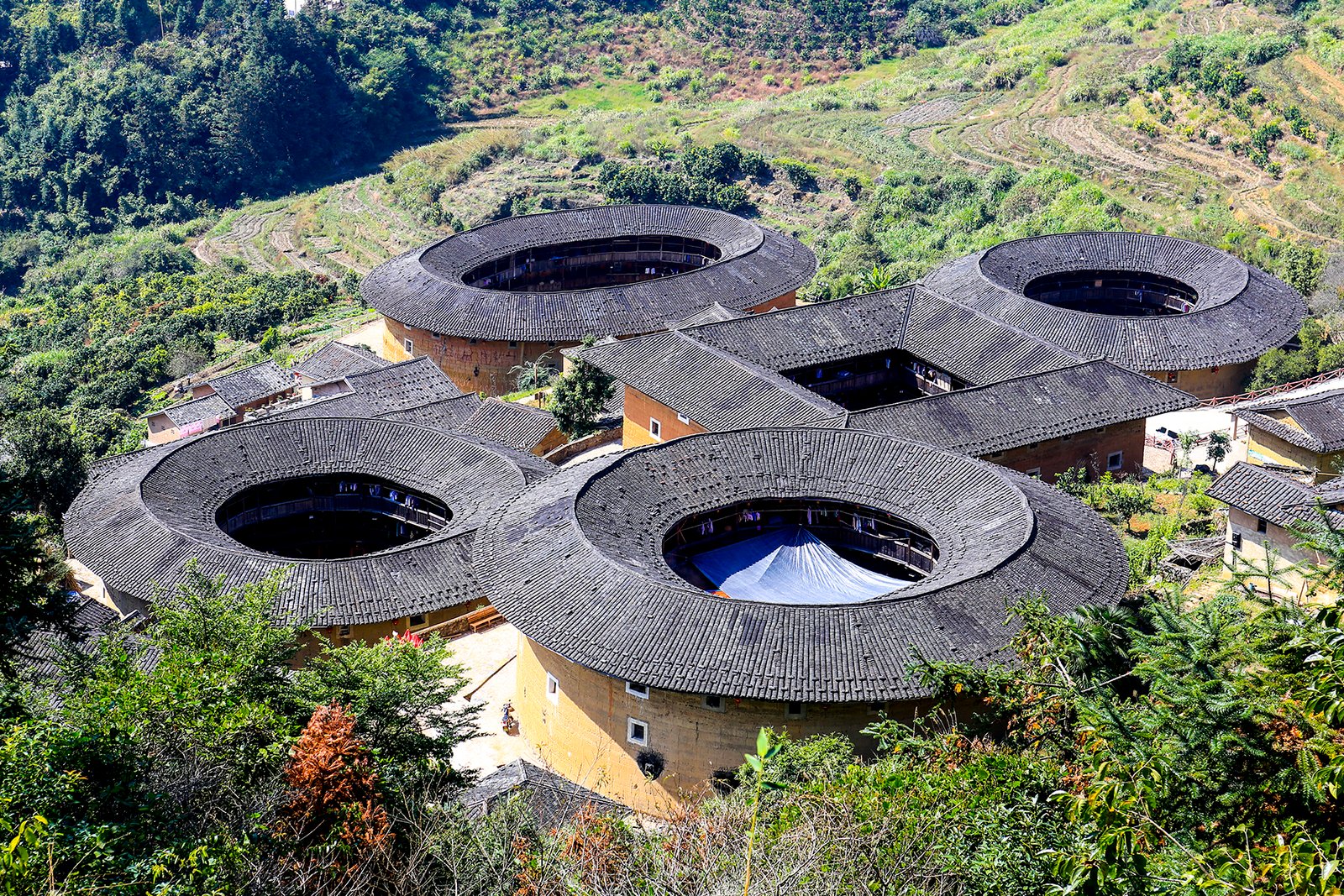 Fujian Tulou: A Traveller's Guide to Hakka Earth Castles 1 The Tianluokeng tulou cluster in Nanjing county, with four round buildings and one square building arranged in a ring