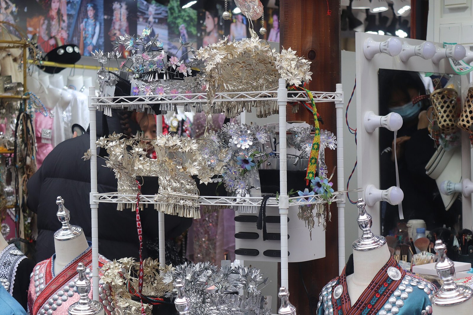 Xijiang: A Thousand Miao Households Lit Up at Dusk 4 Handmade Miao silver hairpin on display in a Xijiang craft workshop
